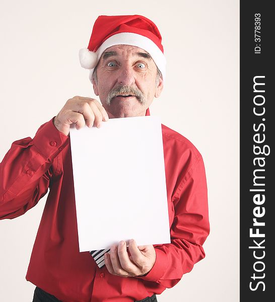 Businessman with blank sign and Santa Claus hat. Businessman with blank sign and Santa Claus hat.