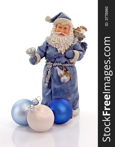 Blue Santa Claus figure with three christmas tree balls on light background. Blue Santa Claus figure with three christmas tree balls on light background