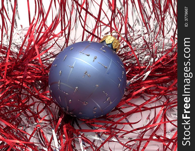 Blue Christmas ball on shiny background