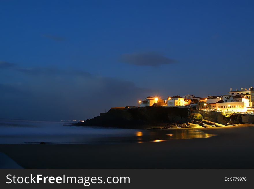 Citylandscape by night in beach, portugal coast (long exposure)