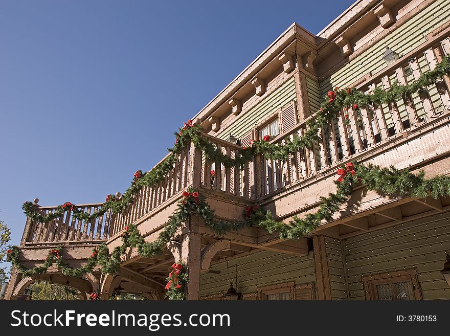 An old western town decorated for Christmas with blue sky
