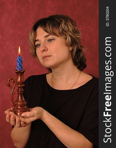 Portrait of the girl with a burning candle