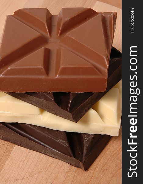 Stack of white, dark and milk chocolate bars. Stack of white, dark and milk chocolate bars