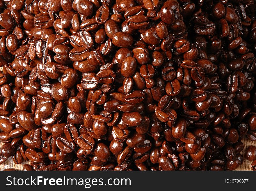 Coffee beans piled together on a table