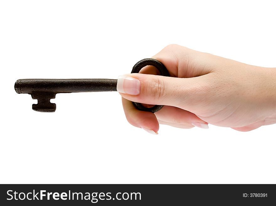 Female hand holding an old and rusty key. Isolated on a white background. Female hand holding an old and rusty key. Isolated on a white background.