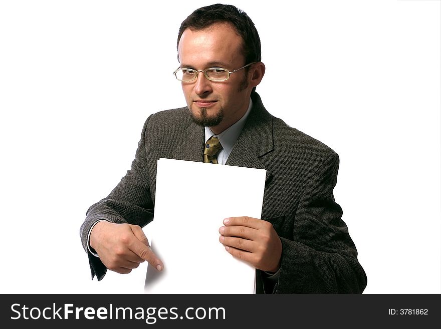Young handsome  businessman pointing to a blank sheet of paper.