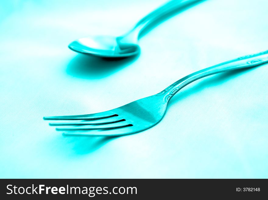 Beautiful artistic tinted image of fork and spoon