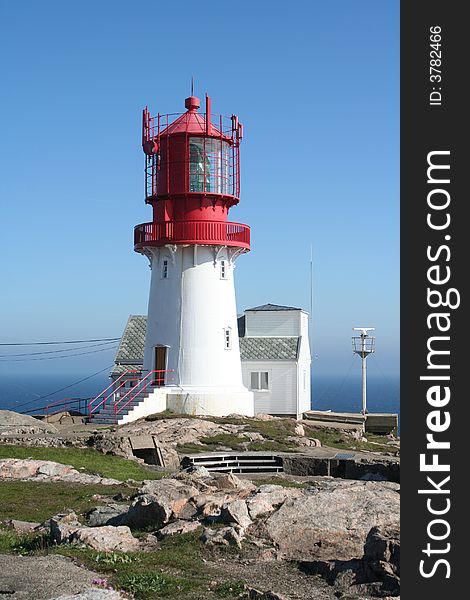 Lighthouse at north Norvegian coastline.