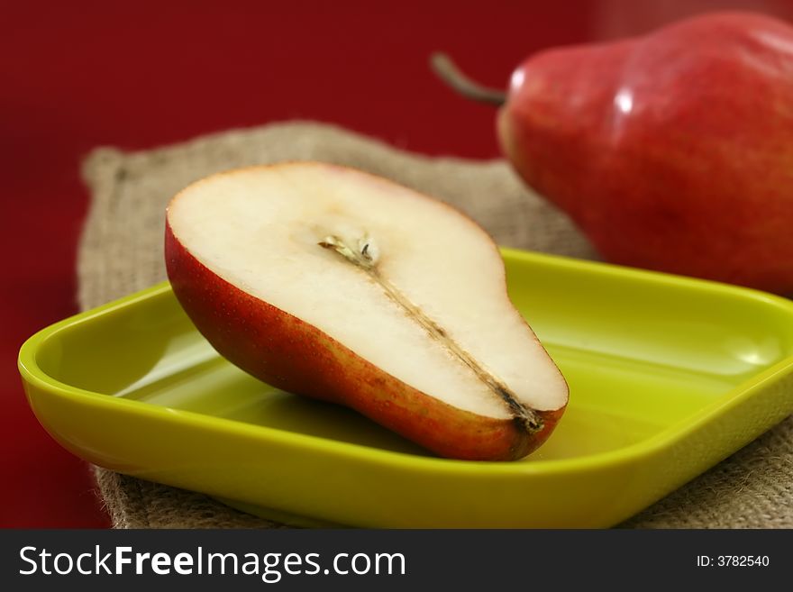 Organic pears close up with a red background. Organic pears close up with a red background