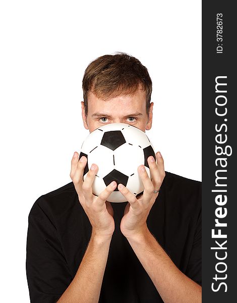 Soccer player holding ball in front of face