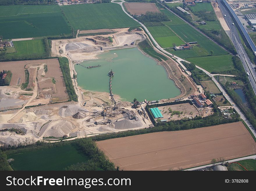 Aerial view of a small artificial lake located between the town Milan and Ticino river. Aerial view of a small artificial lake located between the town Milan and Ticino river