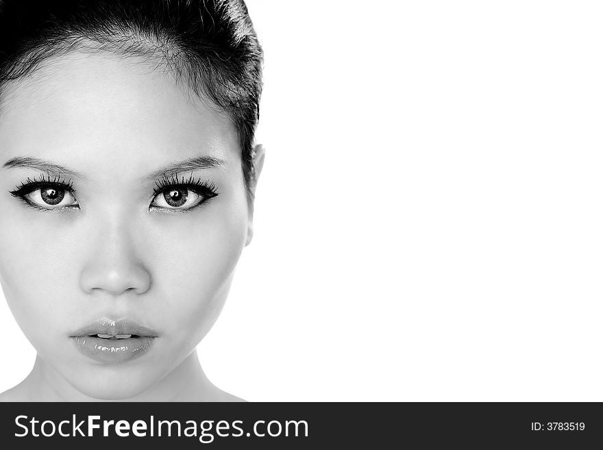 Monochrome image of a young asian girl with a beautiful stare. Monochrome image of a young asian girl with a beautiful stare
