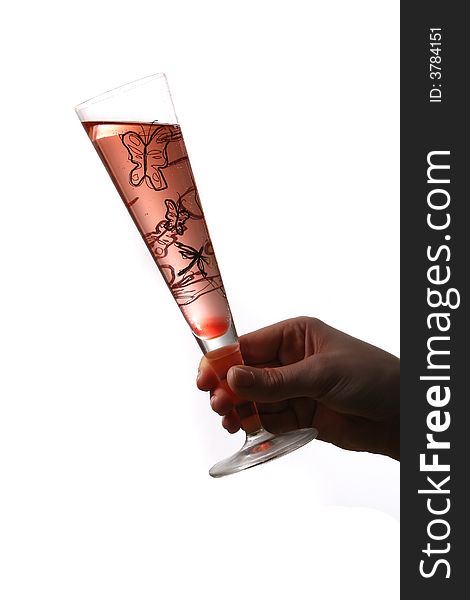 A champagne flute with red champagne with bubbles held by hand. Isolated on white space (for text). A champagne flute with red champagne with bubbles held by hand. Isolated on white space (for text).