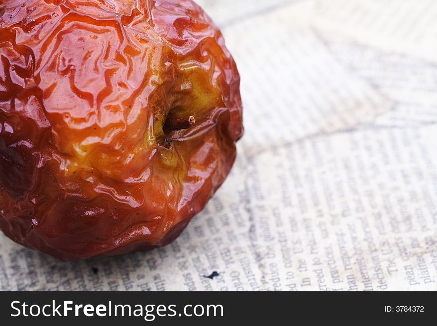 Close up shot of a wrinkled red apple. Close up shot of a wrinkled red apple