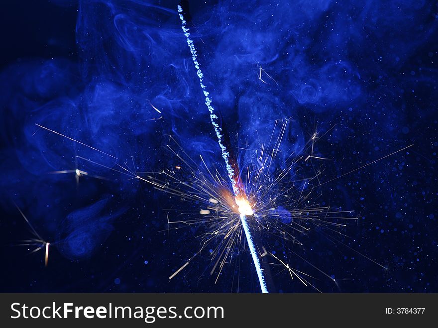 Image of burning sparkler with black background