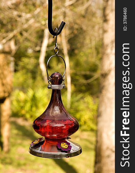 An old fashioned oil lamp hanging on a deck. An old fashioned oil lamp hanging on a deck