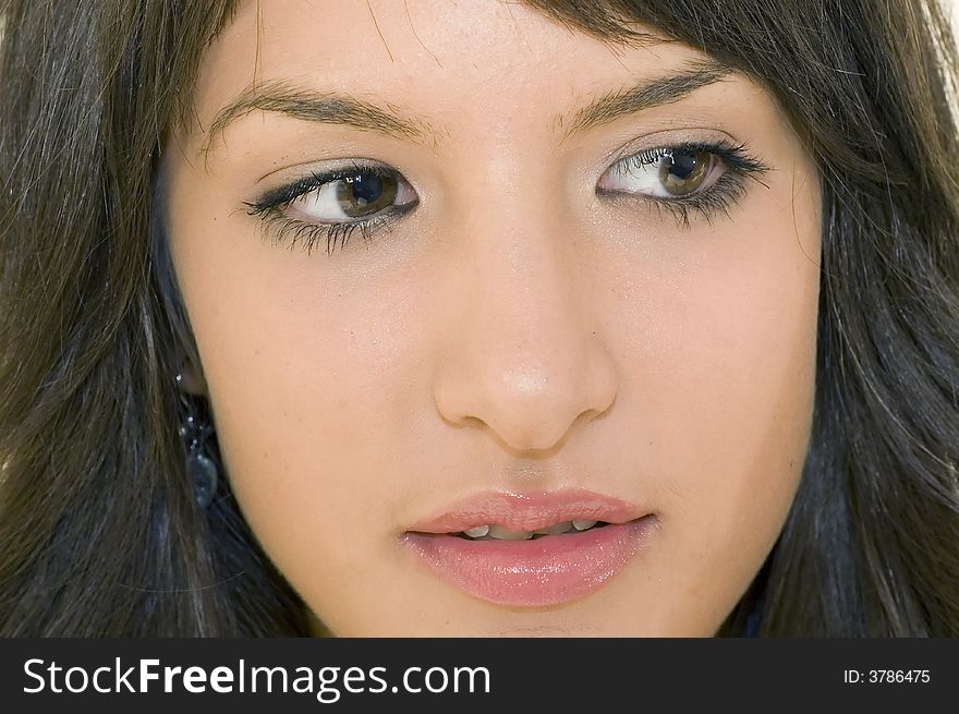 Portrait of young brunette girl with beautiful eyes and face.