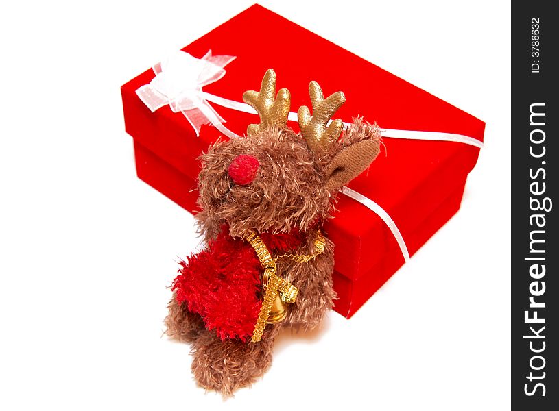 Fluffy Moose Toy Sitting By A Red Box