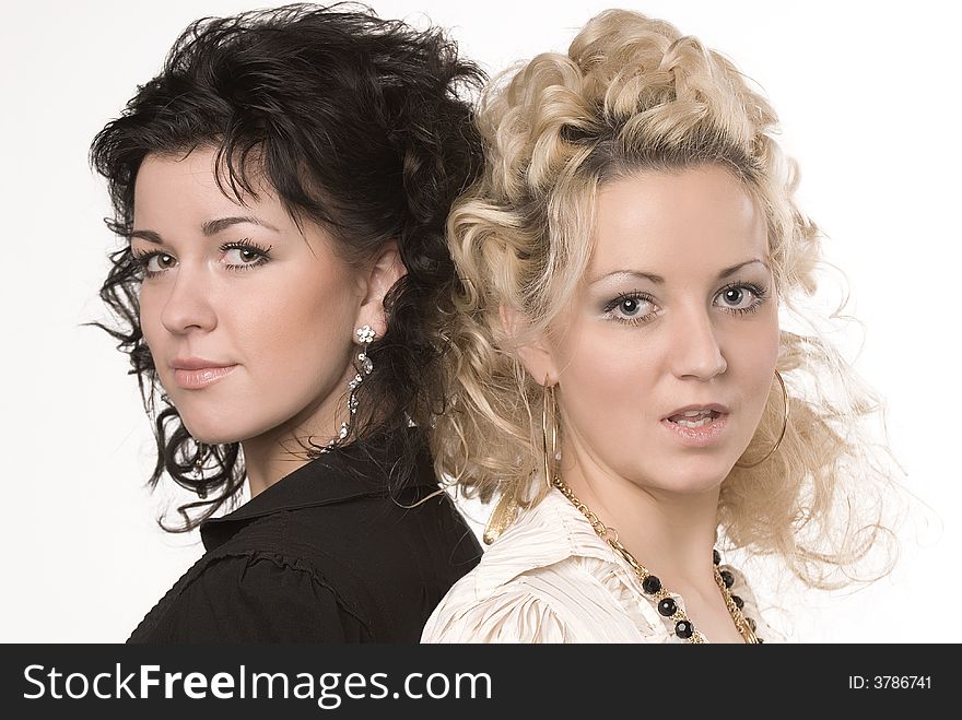 Portrait of two beautiful women on a white background. Portrait of two beautiful women on a white background