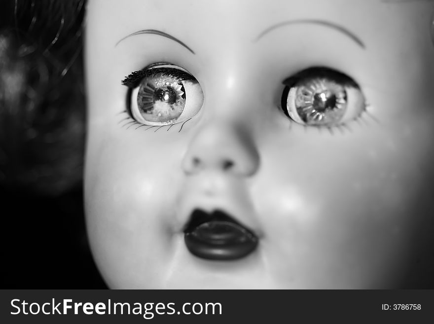 Close up of an old doll in black and white. Close up of an old doll in black and white