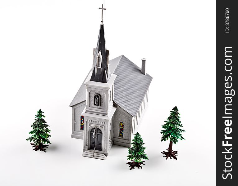 Plastic church and trees on the white background. Plastic church and trees on the white background.