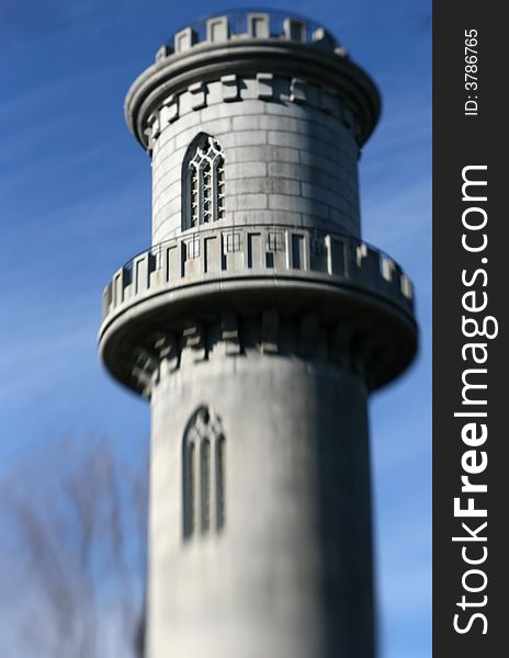 A castle tower against a blue sky with soft focus and lens blur. A castle tower against a blue sky with soft focus and lens blur