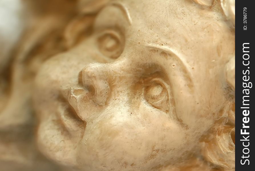 Close up of a an angel carved in stone. Close up of a an angel carved in stone