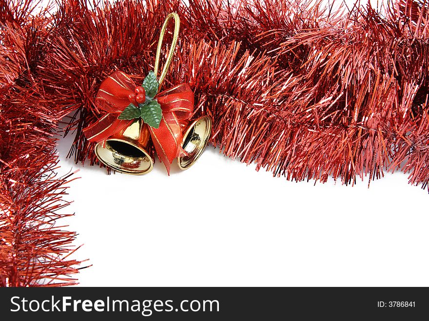 Christmas bells in red tinsel