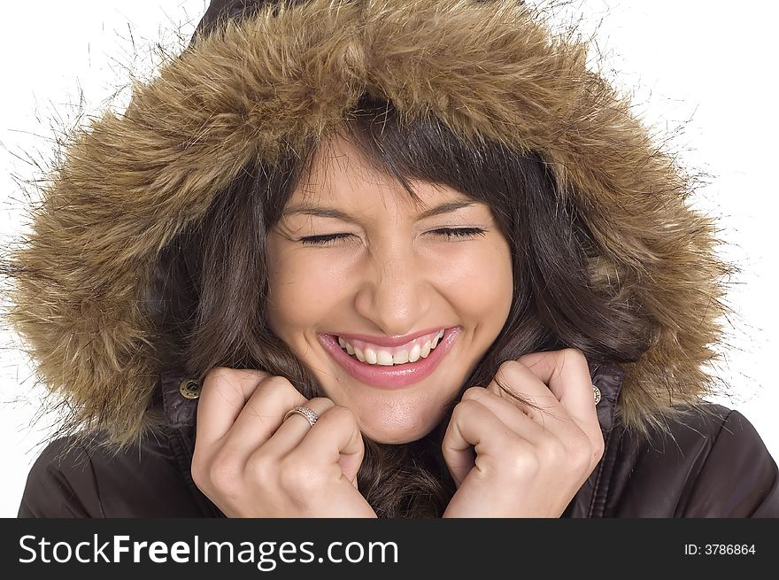 Young brunette girl in brown winter jacket.Happy face and worm look. Young brunette girl in brown winter jacket.Happy face and worm look.