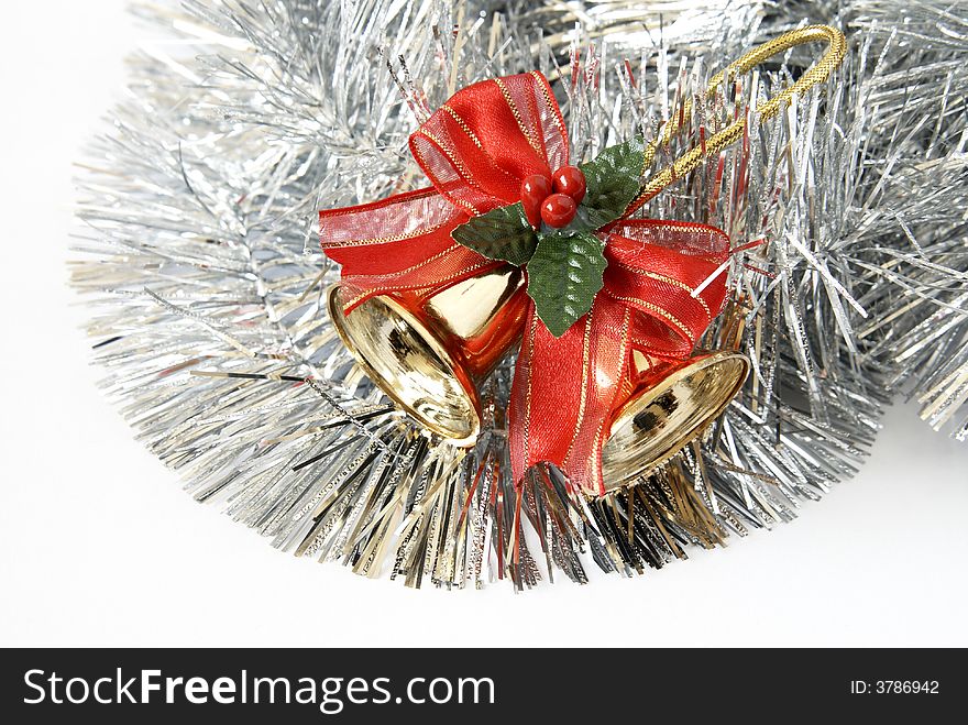 Christmas decoration of two bells in silver tinsel isolated on a white background. Christmas decoration of two bells in silver tinsel isolated on a white background