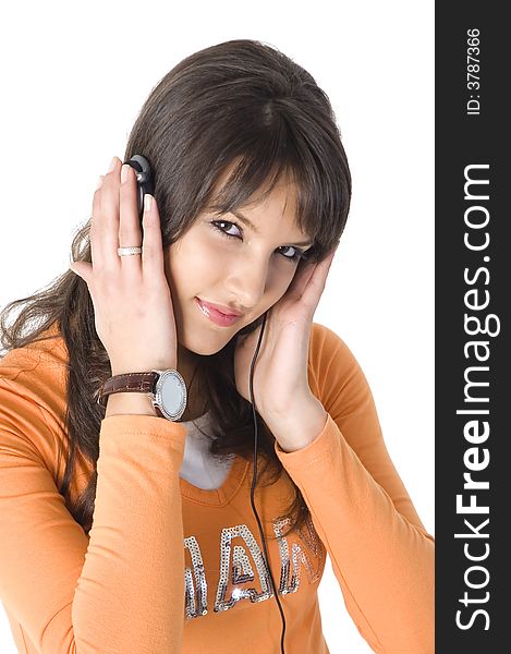 Young brunette girl with headphones listening music. Young brunette girl with headphones listening music.