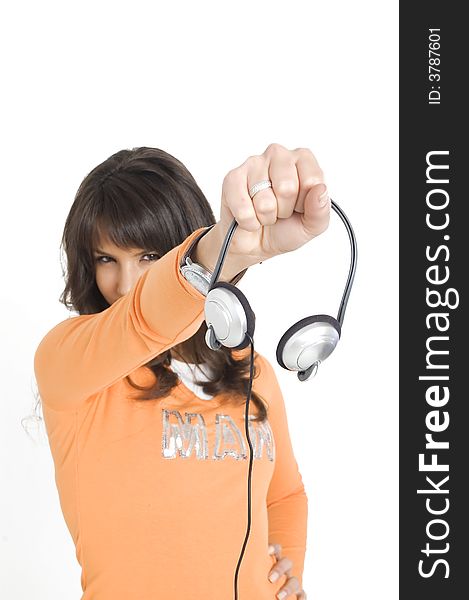 Young brunette girl with headphones in hand. Young brunette girl with headphones in hand.