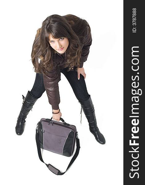 Young brunette teenager girl with laptop bag on white background.