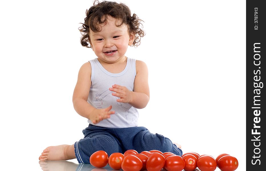 Child with tomato; isolated on a white background. Child with tomato; isolated on a white background.