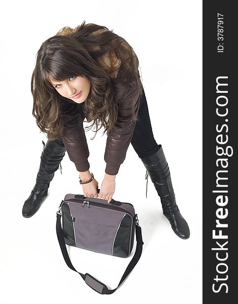 Young brunette teenager girl with laptop bag on white background.