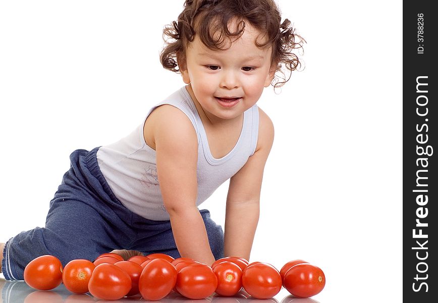 Child with tomato, isolated on a white background. Child with tomato, isolated on a white background.