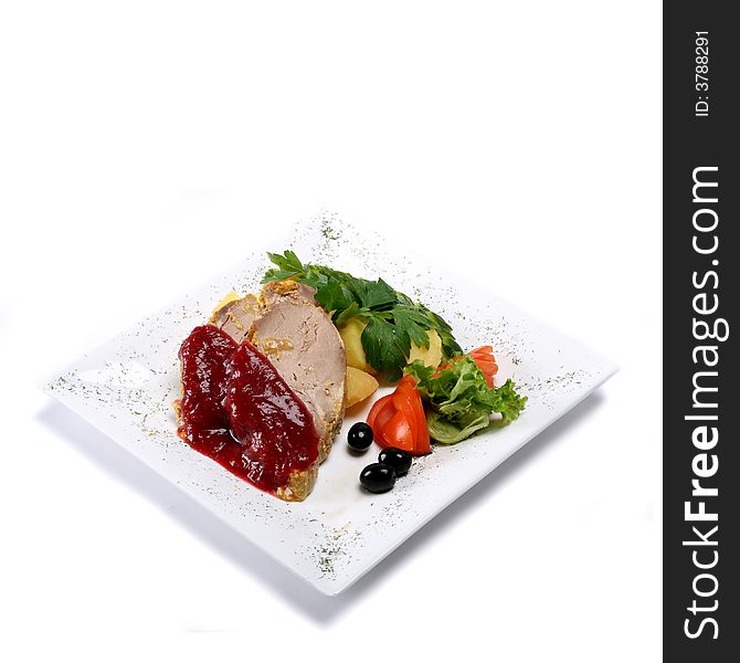 Gourmet pork dish on rectangular plate