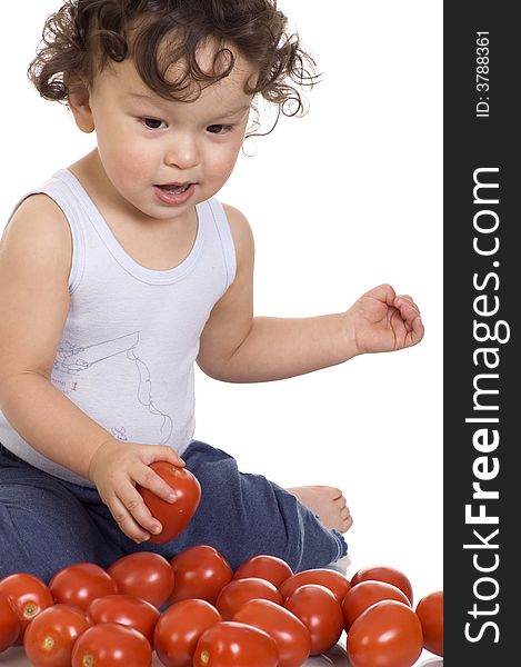 Child with tomato, isolated on a white background. Child with tomato, isolated on a white background.