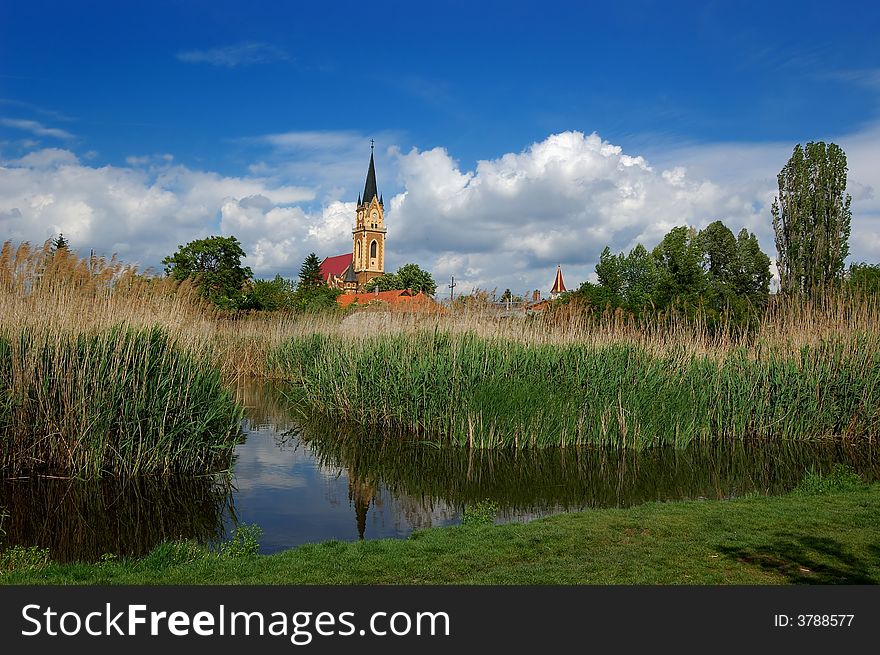 Church tower on the lakeside. Church tower on the lakeside.