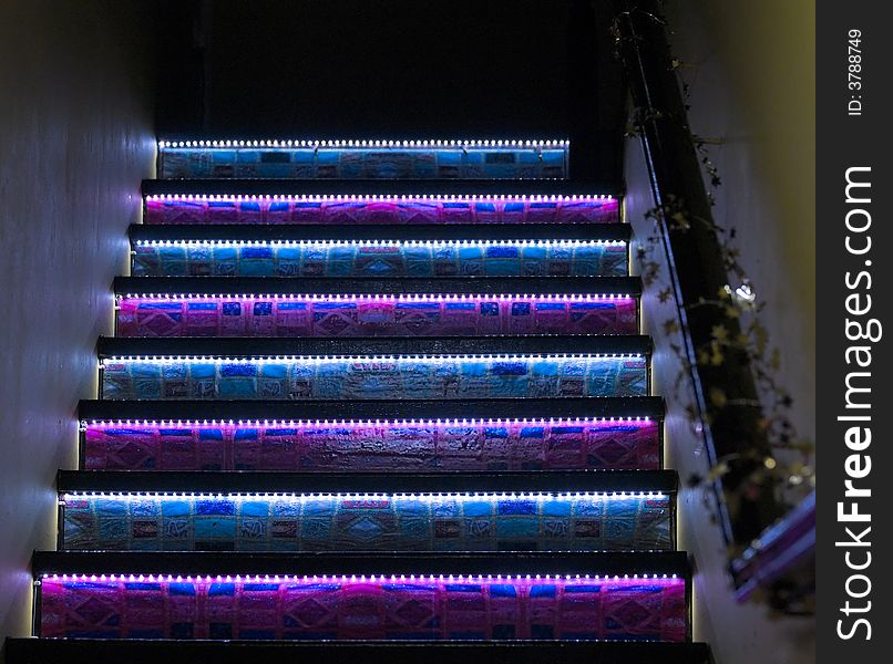 Decorated and Lighted staircase leading up to a restaurant