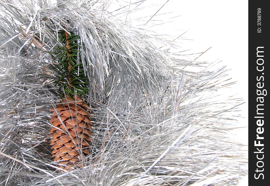 Branch of New Year's fur-trees with strobile. A christmas fur-tree, a celebratory tree, and a silvery tinsel. Branch of New Year's fur-trees with strobile. A christmas fur-tree, a celebratory tree, and a silvery tinsel