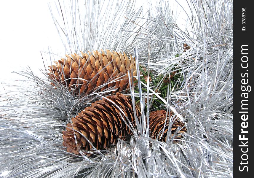 Branch of New Year's fur-trees with strobile. A christmas fur-tree, a celebratory tree, and a silvery tinsel. Branch of New Year's fur-trees with strobile. A christmas fur-tree, a celebratory tree, and a silvery tinsel