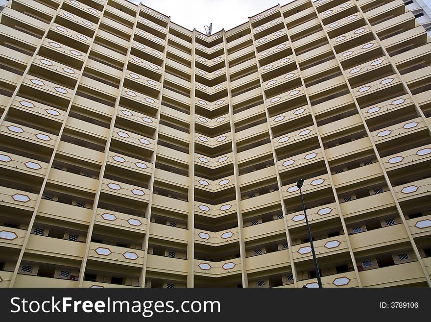 Angled building with a lot of apartments. Angled building with a lot of apartments