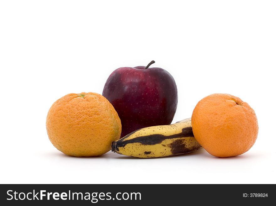 A banana, two tangerines and an apple on a white background. A banana, two tangerines and an apple on a white background