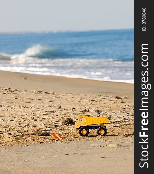 Yellow Toy Truck on Beach