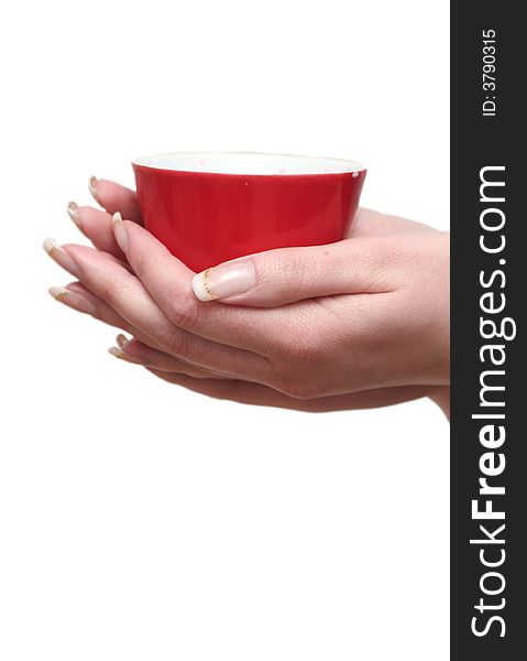 Red cup in female hands on a white background