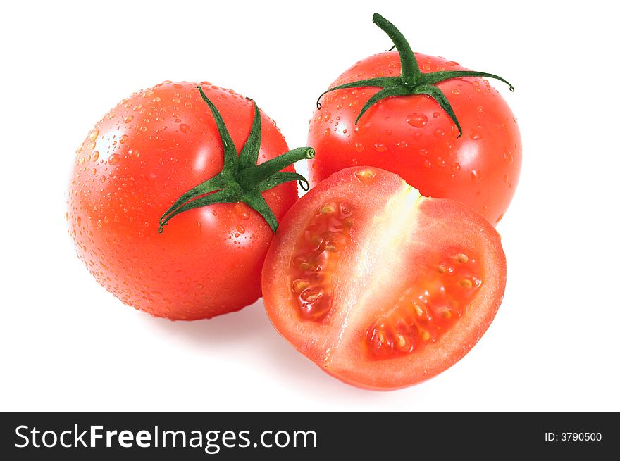 Ripe juicy tomatoes isolated on white; wet. Ripe juicy tomatoes isolated on white; wet