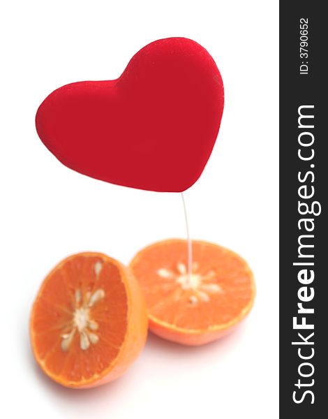 Red heart and orange on a white background