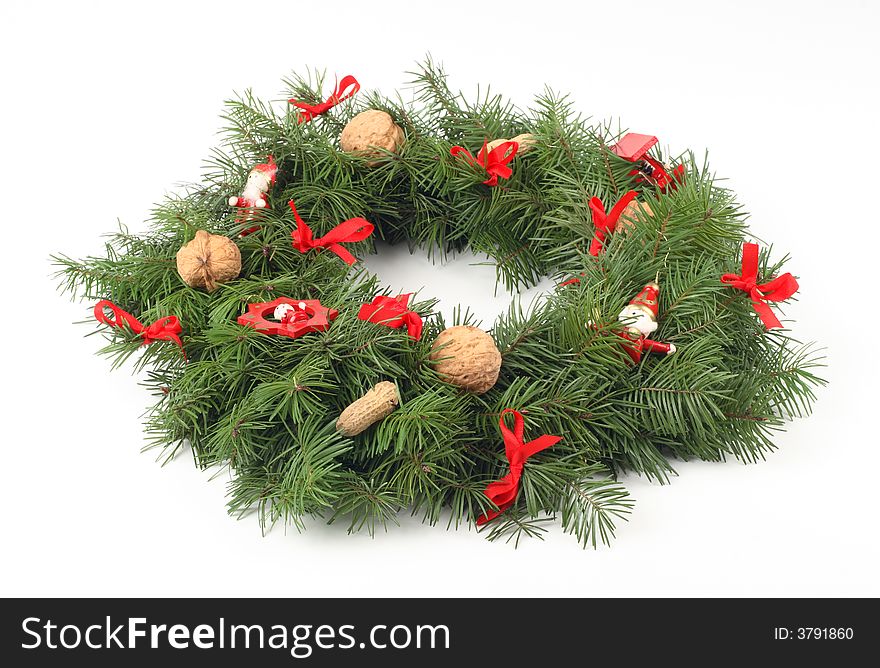 Advent wreath with walnuts, red ribbon