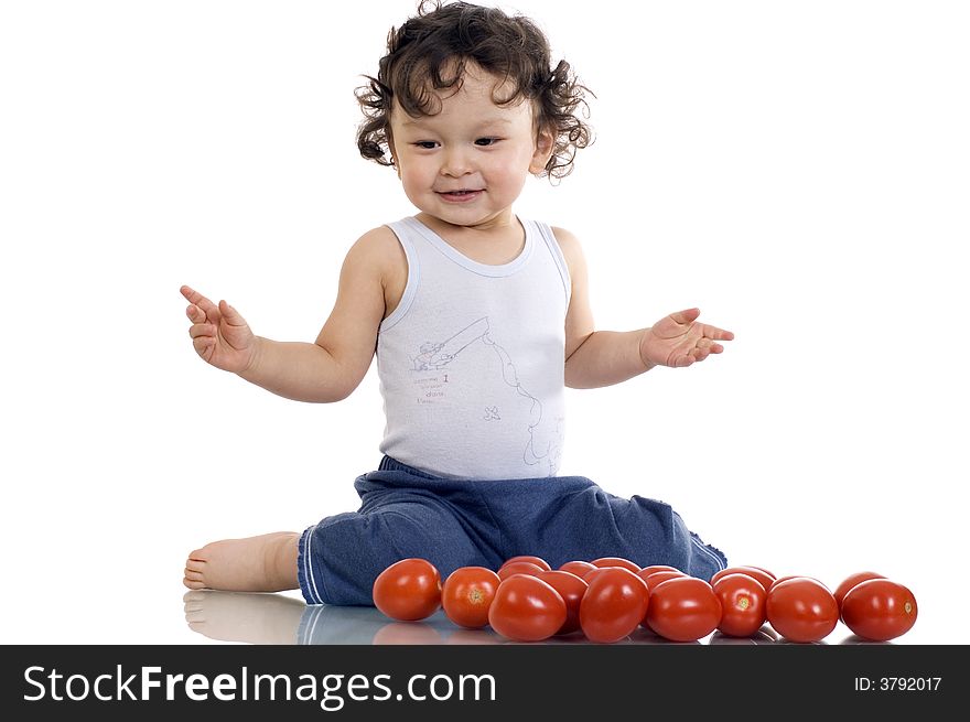 Child with tomato, isolated on a white background. Child with tomato, isolated on a white background.